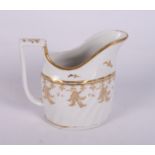 A late 18th Century Worcester porcelain gilt decorated part tea service including teapot, tea bowls,