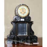 A late 19th Century slate and green marble mantel clock with cylinder movement, mercury pendulum and