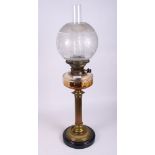 A 19th Century oil lamp with reeded column, cut glass reserve and etched shade, 28" high
