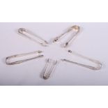 Five pairs of Georgian and later silver sugar tongs, various, 5.7oz troy approx