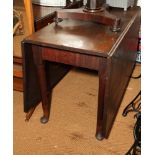 A 19th Century mahogany rectangular Sutherland dining table, on pole turned supports, opening to 64"