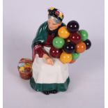 A collection of six Doulton figures, "The Lobster Man", "The Old Balloon Seller", "The Balloon