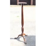 A George III mahogany reeded column torchere, on carved tripod splay supports, 55 1/2" high