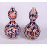 A pair of 19th Century Imari porcelain double gourd vases, 10" high