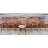 A set of six pine spindle back kitchen chairs and a similar chair