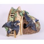 A Worcester porcelain corner bracket formed as blue birds by a nest, 10" high (damages)