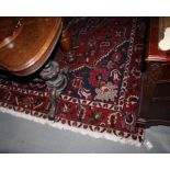 A Hamadan carpet decorated large central red and ivory anchor medallion and blue spandrels on a