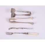 A pair of silver asparagus tongs, a pair of continental silver ice tongs and two pickle forks
