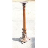 A Victorian mahogany torchere, on scroll work column base and circular foot, 50" high