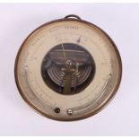 A brass cased aneroid barometer and thermometer, 6 1/2" dia