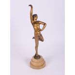 An Art Deco patinated figure of a dancing girl, on onyx base, 14" high (arm restored)