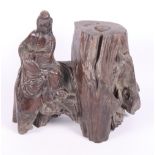 A Chinese carved fruitwood figure of a Sage by a tree stump, 8" high