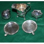 A miniature silver ring box, a silver milk jug, a pair of silver ashtrays and a plated pill box in