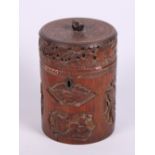 A 19th Century Chinese carved bamboo tea caddy with metal liner and figured panels, 6 1/2" high