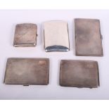 Five silver cigarette cases, three with engine turned decoration, 25.1oz troy approx
