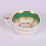 A mid 19th Century bone china green and gilt decorated part tea service for nine