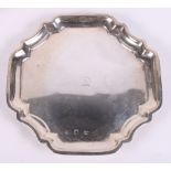 A Georgian silver card tray raised on four supports, 5.2oz troy approx