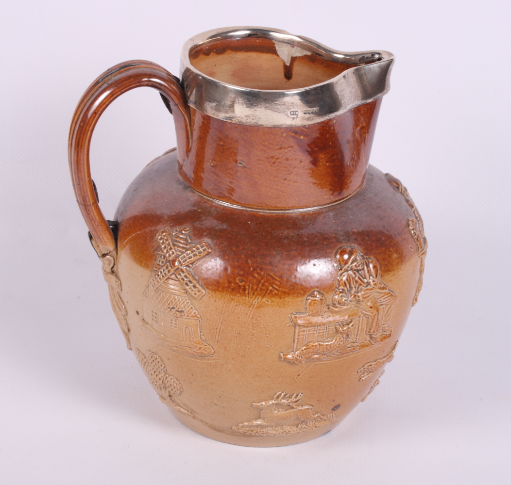 A 19th Century stoneware and silver mounted harvest jug, 7 1/2" high (handle riveted, chip to rim)