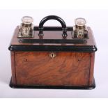 A Victorian figured walnut and ebonised desk inkstand with fall front stationery compartment, 13"