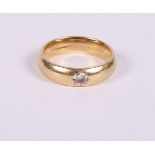 An 18ct gold wedding band set single diamond .20 carat approx, ring size V, 12.2g