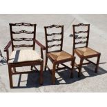 A set of six Georgian design fruitwood ladderback dining chairs with drop-in rush seats fitted squab
