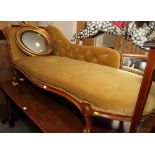 A Victorian mahogany framed scroll end settee, upholstered in a gold velour, 78" long