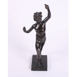 A 19th Century patinated bronze figure of the dancing faun, 8 1/4" high