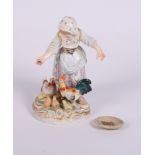 A 19th Century Meissen porcelain figure of a girl feeding chickens on gilt scrollwork base, 5"