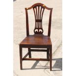 A late Georgian elm provincial side chair of Sheraton design with panel seat, on square taper