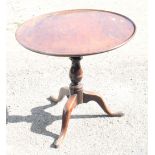 A George III mahogany circular tilt top occasional table, on vase turned column and tripod splay
