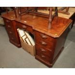 A mahogany breakfront double pedestal desk, fitted nine drawers with carved wood handles, 51" wide