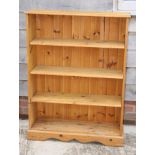 A pine open bookcase, 52" wide