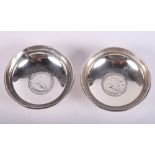 A pair of silver mounted coin dishes, 7.2oz troy approx