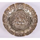 A Victorian silver and parcel gilt dish with embossed panels of fruit and insects, 6.7oz troy