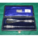 An Art Nouveau silver mounted shoehorn and buttonhook set, in fitted case