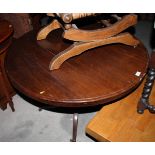 A late 19th Century mahogany circular tilt top dining table, on quadruple splay supports, 39 1/2"
