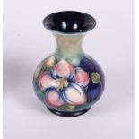 A Moorcroft anemone vase with flared rim, 5" high (crazed glaze)