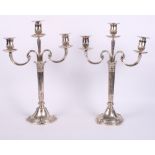 A pair of continental 800 grade silver three-branch candelabrum, Corinthian column stems and