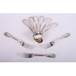 Six silver fiddle and thread pattern dessert spoons with shell cast bowls and finials and three