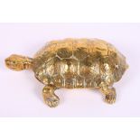 A 19th Century brass inkstand formed as a turtle with lifting shell, 7" long