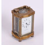 A carriage clock in serpentine brass case by Page, Keen & Page Plymouth and Paris, 5" high