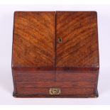A late 19th Century figured walnut slope front stationery cabinet with fitted interior and drawer,