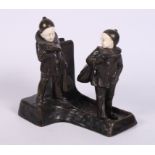 Peter Tereszczuk: an early 20th Century bronze and ivory match box holder with two Pierrot