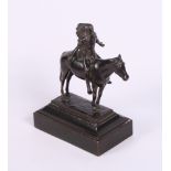 A late 19th Century patinated bronze figure of a Native North American praying on horseback, 9" high