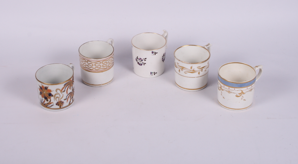 Three early 19th Century Derby bone china coffee cans and saucers and two other coffee cans