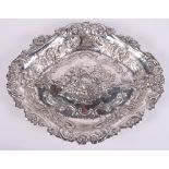 A continental white metal oval dish embossed flowers, fruit and scrolls, 16.3oz troy approx