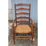 Two Gimson design oak and ash ladderback elbow chairs with cane panel seats and four matching