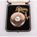 A rolled gold cased half hunter pocket watch with T-bar and chain