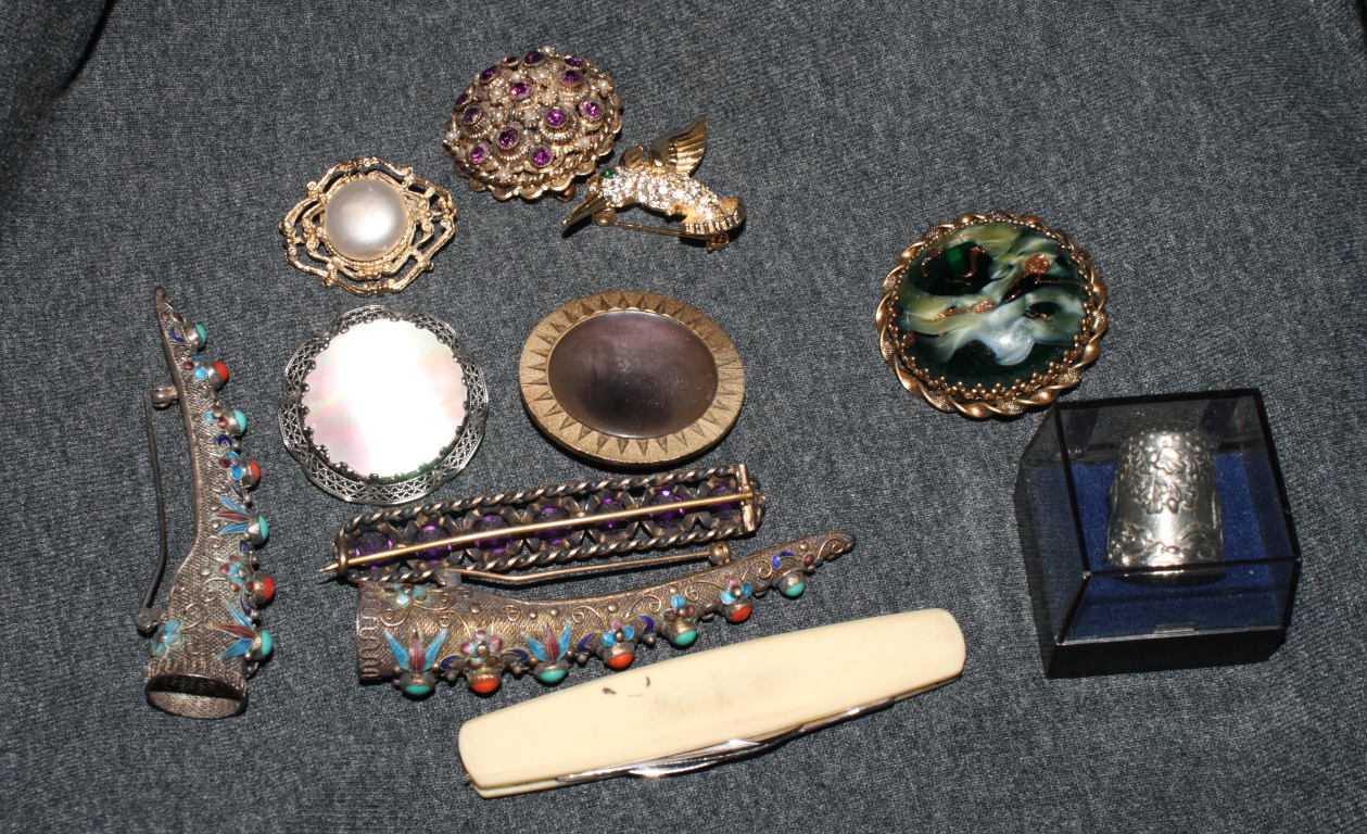 Two Chinese enamelled filigree fingernail guards mounted as brooches and a small collection of