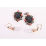 A pair of gold and moonstone drop earrings and a pair of onyx and coral cameo earrings